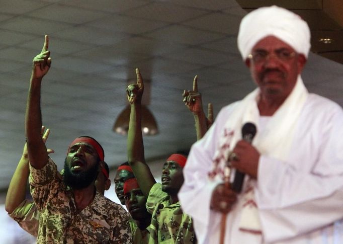 Supporters shout and gesture as Sudanese President Omar al-Bashir addresses a rally at the ruling National Congress Party (NCP) headquarters in Khartoum