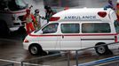 Marshalls clear the way for an ambulance after the race was stopped following a crash by Marussia Formula One driver Jules Bianchi of France at the Japanese F1 Grand Prix