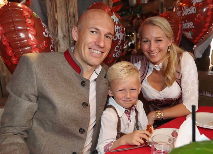 FC Bayern Munich's Robben, his wife Bernadien and their son pose during their visit at the Oktoberfest in Munich