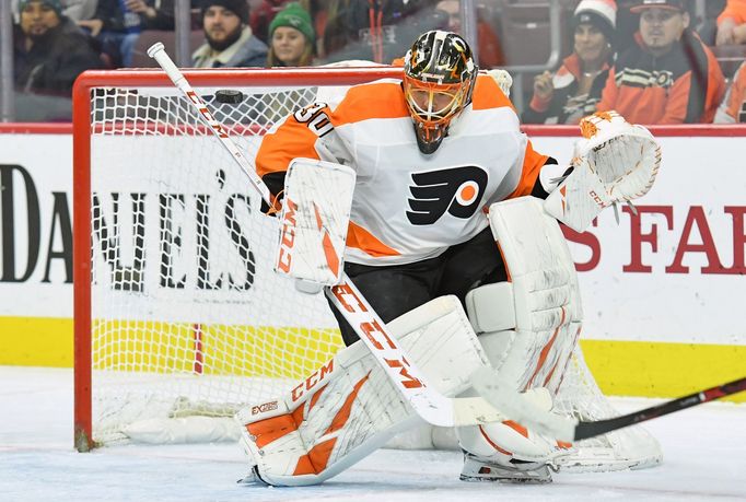 Jan 3, 2019; Philadelphia, PA, USA; Philadelphia Flyers goaltender Michal Neuvirth (30) makes a save against the Carolina Hurricanes during the first period at Wells Farg