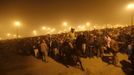 A policeman mounted on his horse maintains order during the first "Shahi Snan" (grand bath) at the ongoing "Kumbh Mela", or Pitcher Festival, in the northern Indian city of Allahabad January 14, 2013. Upwards of a million elated Hindu holy men and pilgrims took a bracing plunge in India's sacred Ganges river to wash away lifetimes of sins on Monday, in a raucous start to an ever-growing religious gathering that is already the world's largest. REUTERS/Ahmad Masood (INDIA - Tags: RELIGION SOCIETY ANIMALS TPX IMAGES OF THE DAY) Published: Led. 14, 2013, 2:05 odp.