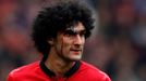 Manchester United's Fellaini bleeds from a head injury during their English Premier League soccer match against Liverpool in Manchester