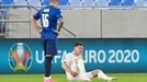 James McCarthy reacts after sustaining an injury alongside Slovakia’s Robert Mazáň