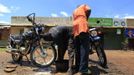 Motorcycle taxi operators wash their bikes in Kogelo village, the ancestral home of U.S. President Barack Obama, at Nyangoma Kogelo shopping centre, 430 km (367 miles) west of Kenya's capital Nairobi, November 5, 2012. Four years ago, Kogelo, and Africa in general, celebrated with noisy gusto when Obama, whose father came from the scattered hamlet of tin-roofed homes, became the first African-American to be elected president of the United States. Looking across the Atlantic to the Nov. 6 presidential election, the continent is cooler now towards the "son of Africa" who is seeking a second term. There are questions too whether his Republican rival, Mitt Romney, will have more to offer to sub-Saharan Africa if he wins the White House. To match Analysis AFRICA-USA/ELECTION REUTERS/Thomas Mukoya (KENYA - Tags: SOCIETY ELECTIONS POLITICS USA PRESIDENTIAL ELECTION) Published: Lis. 5, 2012, 11:08 dop.