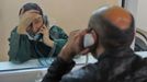 Ivanovo Region prison colony for convicted women IVANOVO REGION, RUSSIA. APRIL 25, 2012. A convicted woman speaks to a relative or friend by telephone through a glass wall at Women's Prison Colony No3 of the Ivanovo Region branch of the Russian Federal Service of Execution of Sentences (UFSIN), seen through an open window