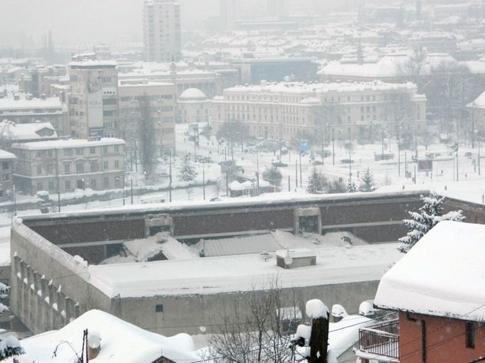 View of the Skenderija sports center in downtown Sarajevo, Bosnia that was used for ice skating events in the 1984 Winter Olympics after it collapsed under the weight of heavy snow, early Sunday Feb. 12, 2012. No injuries or fatalties have been reported according to police. Bosnia has been paralyzed for over a week by the highest snow ever recorded. Last weekend it hit 107 centimeters in downtown Sarajevo and over 2.5 meters in the surrounding mountains. On Sunday the snow settled down to 90 centimeters. Temperatures as low as -22 throughout the week made clearing difficult (AP Photo)