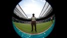 A soldier stands on Centre Court at the Wimbledon Tennis Championships, in London June 25, 2013. Photograph taken with a fish-eye lens. REUTERS/Eddie Keogh (BRITAIN - Tag