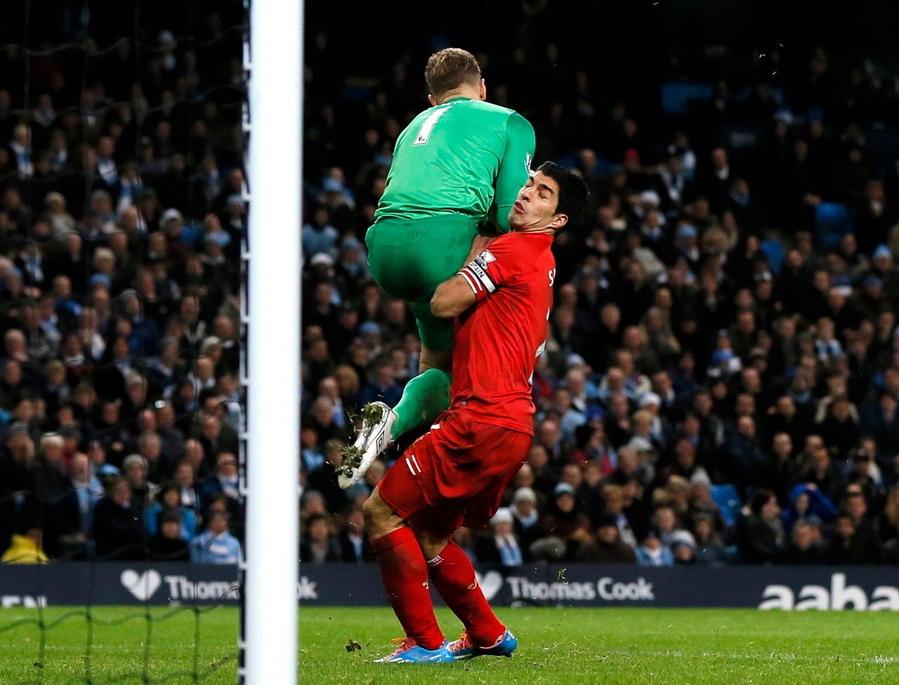 Liverpool's Suarez collides with Manchester City's Hart during their English Premier League soccer match in Manchester