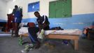 Somali athletes remove their shoes inside their room after a training session as part of their preparations for the 2012 London Olympic Games in Somalia's capital Mogadishu March 14, 2012 file photos. Training in a bullet-riddled stadium where the remains of a rocket propelled grenade lies discarded on the track's edge counts as progress for Somali Olympic hopeful Mohamed Hassan Mohamed. A year ago, Mogadishu's Konis stadium was a base for Islamist militants and a work out meant at times running through the streets, dodging gun-fire and mortar shells in one of the world's most dangerous cities. To match OLY-SOMALIA-HOPES/ REUTERS/Feisal Omar/Files (SOMALIA - Tags: SPORT ATHLETICS SOCIETY OLYMPICS) Published: Čer. 11, 2012, 6:47 dop.