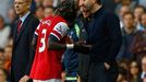 Arsenal's Sagna reacts after he was hit by a ball thrown by Tottenham Hotspur's manager Sherwood during their English Premier League soccer match in London