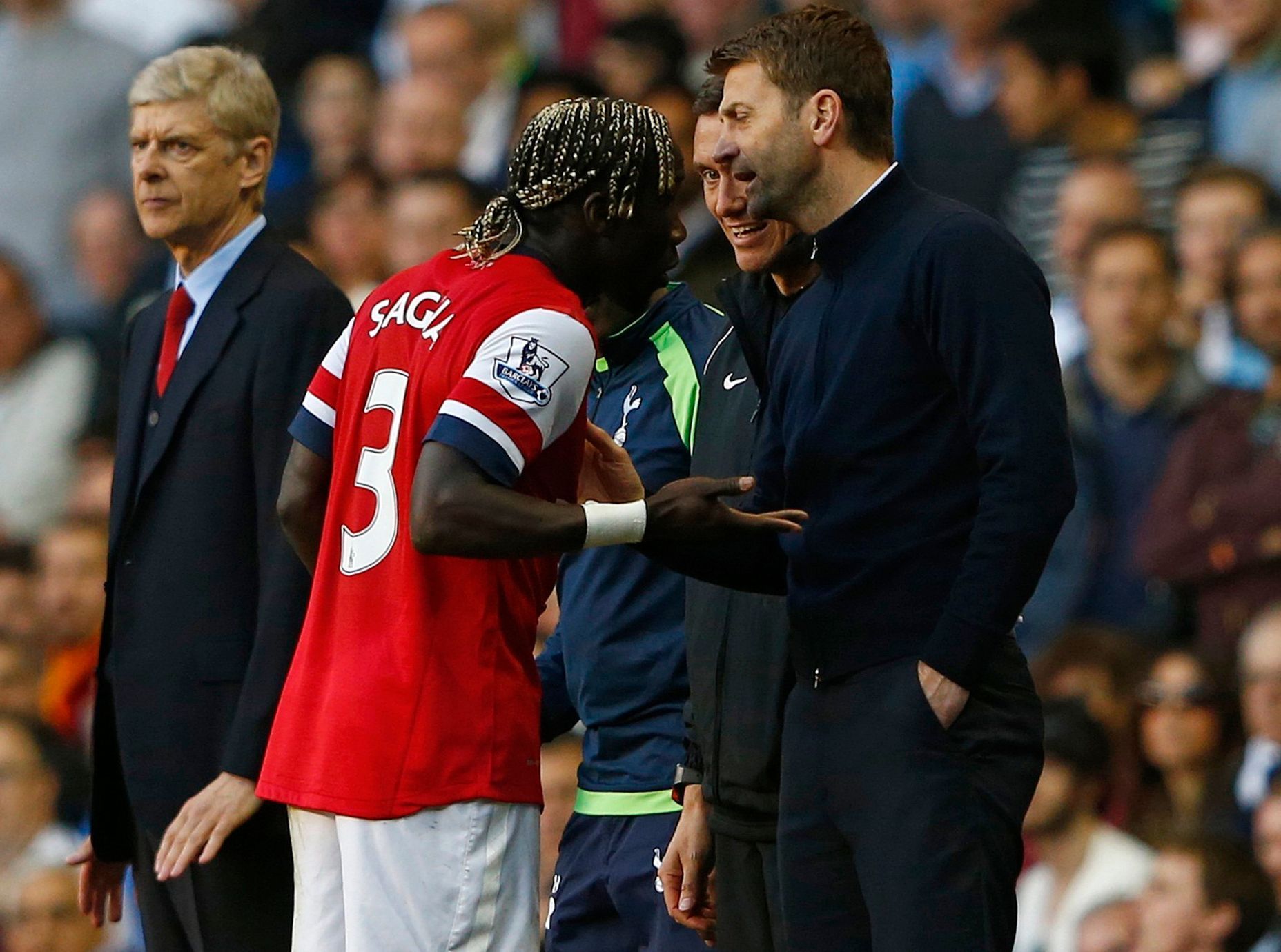 Arsenal's Sagna reacts after he was hit by a ball thrown by Tottenham Hotspur's manager Sherwood during their English Premier League soccer match in London