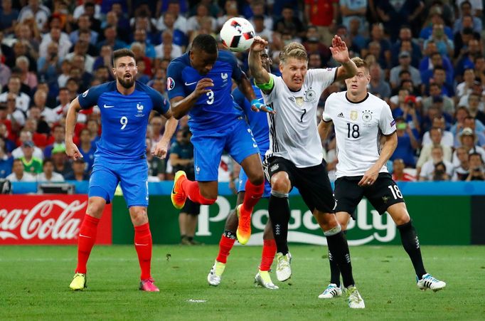 Germany's Bastian Schweinsteiger handles the ball and concedes a penalty