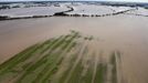 An aerial view shows the waters of the Elbe river inundating agricultural fields during floods near Magdeburg in the federal state of Saxony Anhalt, June 10, 2013. Tens of thousands of Germans, Hungarians and Czechs were evacuated from their homes on Wednesday as soldiers raced to pile up sandbags to hold back rising waters in the region's worst floods in a decade. REUTERS/Thomas Peter (GERMANY - Tags: DISASTER ENVIRONMENT AGRICULTURE)