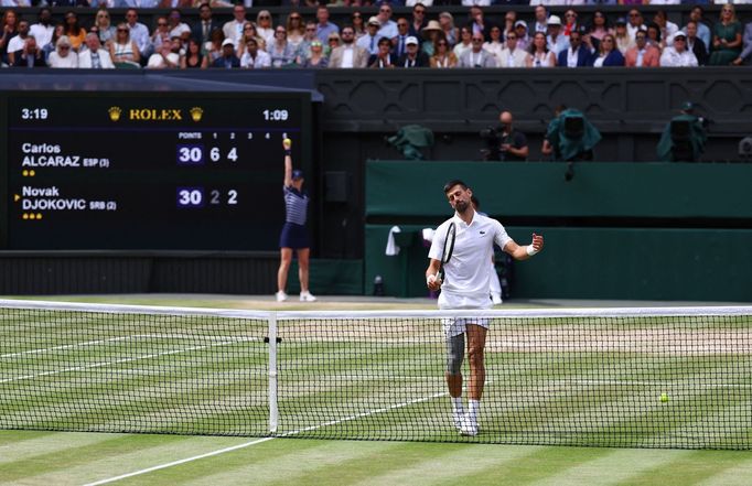 Tennis - Wimbledon - All England Lawn Tennis and Croquet Club, London, Britain - July 14, 2024 Serbia's Novak Djokovic reacts during his men's singles final against Spain