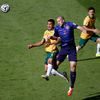 Australia's Cahill and Vlaar of the Netherlands fight for the ball during their 2014 World Cup Group B soccer match at the Beira Rio stadium in Porto Alegre