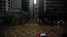 A taxi drives across an empty street in Hong Kong's business central district as Typhoon Vicente approaches July 24, 2012. Hong Kong raised its highest tropical cyclone warning on Tuesday as an intensifying severe typhoon edged closer towards the financial hub, grounding flights and forcing the port to close.Financial markets, schools, businesses and non-essential government services close when any No. 8 or above signal is hoisted, posing a disruption to business in the capitalist hub and former British colony that returned to Chinese rule in 1997. REUTERS/Tyrone Siu (CHINA - Tags: ENVIRONMENT DISASTER) Published: Čec. 24, 2012, 12:58 dop.