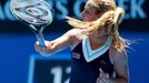 Dominika Cibulkova of Slovakia hits a return to Francesca Schiavone of Italy during their women's singles match at the Australian Open 2014 tennis tournament in Melbourne