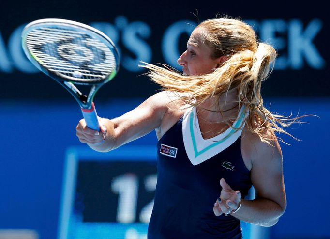 Dominika Cibulkova of Slovakia hits a return to Francesca Schiavone of Italy during their women's singles match at the Australian Open 2014 tennis tournament in Melbourne