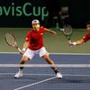 Japan's Uchiyama hits a return beside his compatriot Ito during their Davis Cup quarter-final men's doubles tennis match against Czech Republic's Stepanek and Rosol in Tokyo
