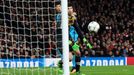 Barcelona's Luis Suárez heads wide as Arsenal's Petr Cech looks on