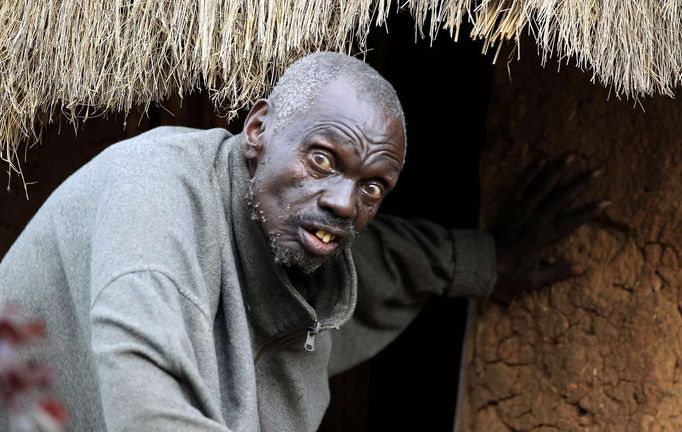 John Dimo, a traditional witch-doctor, walks out of his mud-hut before performing an ancient rite with mystical artifacts to predict the outcome of the U.S. elections in Kogelo village, Nyangoma Kogelo, 430 km (367 miles) west of Kenya's capital Nairobi, November 5, 2012. Kogelo is the ancestral home of U.S. President Barack Obama. Dimo, about 115-years-old, says he knew Obama's father who was buried in the village in 1982. The former army officer says he inherited his trade as a witch-doctor from his father in 1962 and is certain his rite will help favour Obama in the U.S. elections. Four years ago, Kogelo, and Africa in general, celebrated with noisy gusto when Obama, whose father came from the scattered hamlet of tin-roofed homes, became the first African-American to be elected president of the United States. Looking across the Atlantic to the November 6 presidential election, the continent is cooler now towards the "son of Africa" who is seeking a second term. There are questions too whether his Republican rival, Mitt Romney, will have more to offer to sub-Saharan Africa if he wins the White House. To match Analysis AFRICA-USA/ELECTION REUTERS/Thomas Mukoya (KENYASOCIETY ELECTION - Tags: SOCIETY ELECTIONS POLITICS USA PRESIDENTIAL ELECTION) Published: Lis. 5, 2012, 4:23 odp.