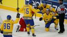 Sweden's Nicklas Danielsson (R) celebrates his goal against Belarus during the first period of their men's ice hockey World Championship quarter-final game at Minsk Arena