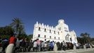 Afghan immigrants wait for temporary documents, which allows them to buy tickets for a ferry to Athens