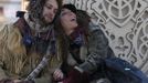 Steven Babson (L) and Lila Wright sit at the Temple of Juno at sunrise during the Burning Man 2012 "Fertility 2.0" arts and music festival in the Black Rock Desert of Nevada, August 29, 2012. More than 60,000 people from all over the world have gathered at the sold out festival, which is celebrating its 26th year, to spend a week in the remote desert cut off from much of the outside world to experience art, music and the unique community that develops.