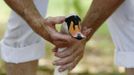 A swan is inspected by a Queen's Swan Upper during the annual Swan Upping ceremony on the River Thames between Shepperton and Windsor in southern England July 15, 2013. Y