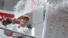 Mercedes Formula One driver Nico Rosberg of Germany sprays champagne as he celebrates on the podium after winning the German F1 Grand Prix at the Hockenheim racing circui