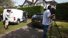 Media photograph the home of Saad al-Hilli in Claygate, south of London September 6, 2012. French police have found a girl aged about 4 alive in a car with the dead bodies of three adult relatives following a gruesome shooting attack on a family of British holidaymakers on a remote road in the French Alps. The English-speaking girl was discovered around midnight on Wednesday, huddled between the front and back seats of the British-registered BMW, under the legs of two dead women thought to be her mother and grandmother, a public prosecutor said. REUTERS/Neil Hall (BRITAIN - Tags: CRIME LAW) Published: Zář. 6, 2012, 12:19 odp.