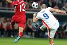 Striker Jan Koller shooting at goal, with Emre Güngör trying to block his attempt.