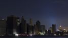 A largely powerless downtown Manhattan stands under a night sky due to a power blackout caused by Hurricane Sandy in New York October 31, 2012. New York City and the sodden U.S. Northeast began an arduous journey back to normal on Wednesday after mammoth storm Sandy killed at least 64 people in a rampage that swamped coastal cities and cut power to millions. The power companies had restored electricity to some 2.4 million customers in the U.S. Northeast, although the pace of recovery in New York appeared to lag behind other storm-hit states, according to the Department of Energy (DOE) data. REUTERS/Lucas Jackson (UNITED STATES - Tags: ENVIRONMENT DISASTER CITYSPACE) Published: Lis. 1, 2012, 3:40 dop.