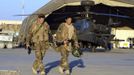 Britain's Prince Harry (L) walks with a fellow pilot at Camp Bastion, southern Afghanistan in this photograph taken November 1, 2012, and released January 21, 2013. The Prince, who is serving as a pilot/gunner with 662 Squadron Army Air Corps, is on a posting to Afghanistan that runs from September 2012 to January 2013. Photograph taken November 1, 2012. REUTERS/John Stillwell/Pool (AFGHANISTAN - Tags: MILITARY POLITICS SOCIETY ROYALS CONFLICT) Published: Led. 21, 2013, 7:37 odp.