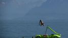 A young man jumps from a pedalo into the water of Lake Leman as he and his friends enjoy a hot summer day in Lausanne August 17, 2012. The Federal Office of Meteorology MeteoSwiss has launched a warning for a heat wave for the weekend until Wednesday August 22. REUTERS/Denis Balibouse (SWITZERLAND - Tags: ENVIRONMENT TPX IMAGES OF THE DAY SOCIETY) Published: Srp. 17, 2012, 2:26 odp.