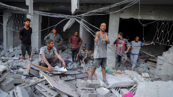 A Palestinian man reacts as he inspects the site of Israeli strikes on houses at Shati (Beach) refugee camp, amid an Israeli military operation, in Gaza City September 23