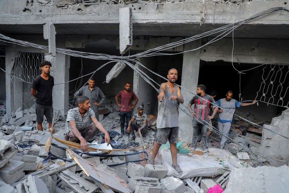 A Palestinian man reacts as he inspects the site of Israeli strikes on houses at Shati (Beach) refugee camp, amid an Israeli military operation, in Gaza City September 23