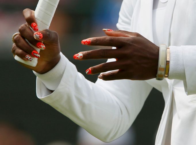 Serena Williams of the U.S. warms up before her women's singles tennis match against Caroline Garcia of France at the Wimbledon Tennis Championships, in London June 27, 2