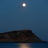 The supermoon rises over the Temple of Poseidon in Cape Sounion, east of Athens