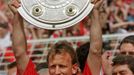 FILE PHOTO: Andreas Brehme of Kaiserslautern holds up the trophy of Germany's first league soccer championship in Hamburg May 9. Kaiserslautern won the championship by po