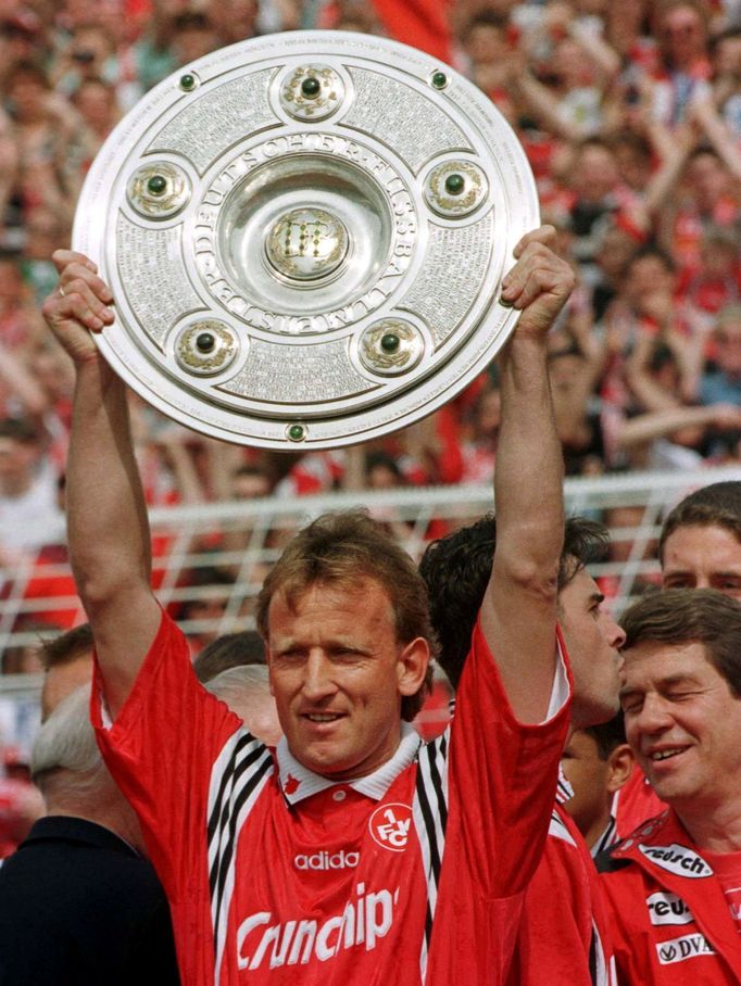 FILE PHOTO: Andreas Brehme of Kaiserslautern holds up the trophy of Germany's first league soccer championship in Hamburg May 9. Kaiserslautern won the championship by po