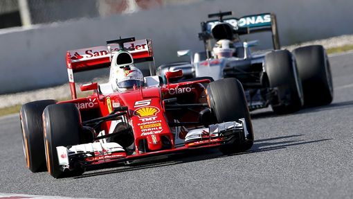 Ferrari F1 driver Sebastian Vettel drives followed by Mercedes F1 driver Lewis Hamilton.