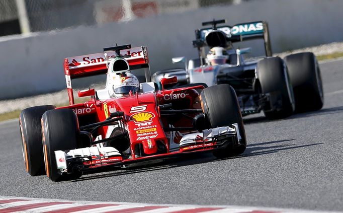 Ferrari F1 driver Sebastian Vettel drives followed by Mercedes F1 driver Lewis Hamilton.