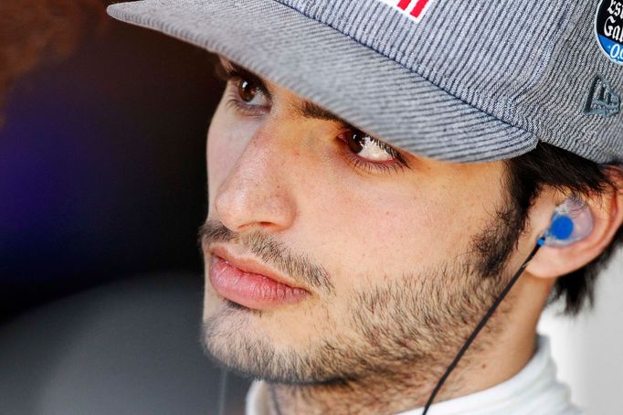 Toro Rosso Formula One driver Carlos Sainz of Spain looks on during the second practice session of the Australian F1 Grand Prix at the Albert Park circuit in Melbourne Ma