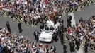 Pope Francis (C) waves from the Popemobile at the end of a canonization mass in Saint Peter's Square at the Vatican May 12, 2013. The Pope led a mass on Sunday for candidates for sainthood Antonio Primaldo, Mother Laura Montoya and Maria Guadalupe Garcia Zavala.