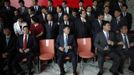 Trainees prepare to pose for a group photo after attending a training course at the communist party school called China Executive Leadership Academy of Pudong in Shanghai, September 24, 2012. China's Communist Party has dramatically stepped up its training of the country's roughly 40 million party and government officials in the past decade. With public scrutiny of cadre behaviour growing via social media, the party is likely to call for continued, and deepened, cadre education at the upcoming 18th Party Congress. At the vanguard of this education drive, alongside a Central Party School in Beijing, are three "Executive Leadership Academies" which opened in 2005 for middle-ranking and senior officials in Shanghai, Yan'an and Jinggangshan. The curriculum covers Marxism, Leninism and Mao Zedong Thought, but students may also take finance courses, receive in-depth media training or role-play crisis management scenarios on everything from disease outbreaks to train wrecks. REUTERS/Carlos Barria (CHINA - Tags: POLITICS SOCIETY) Published: Zář. 24, 2012, 1:29 odp.