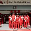 Ferrari engineers block the view of Ferrari Formula One driver Kimi Raikkonen of Finland as they stand around his car during the first practice session of the Bahrain F1 Grand Prix at the Bahrain Inte