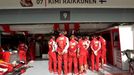 Ferrari engineers block the view of Ferrari Formula One driver Kimi Raikkonen of Finland as they stand around his car during the first practice session of the Bahrain F1