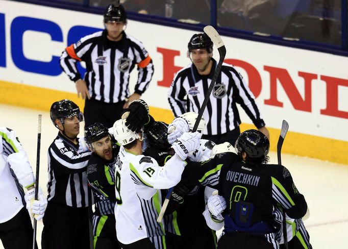 Jan 25, 2015; Columbus, OH, USA; Members of Team Toews and Team Foligno are separated by linesman Tony Sericolo (84) after a whistle in the second period in the 2015 NHL