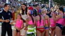 Catherine, Britain's Duchess of Cambridge, smiles as she walks among junior surf lifesavers during her visit to a surf lifesaving demonstration at Sydney's Manly beach